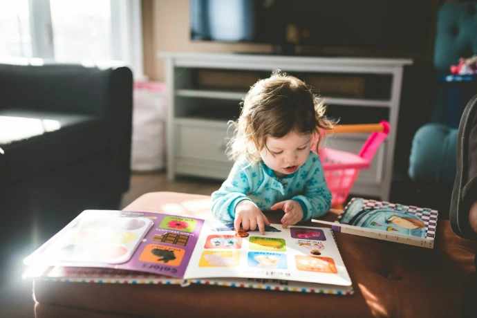 child reading book for sale